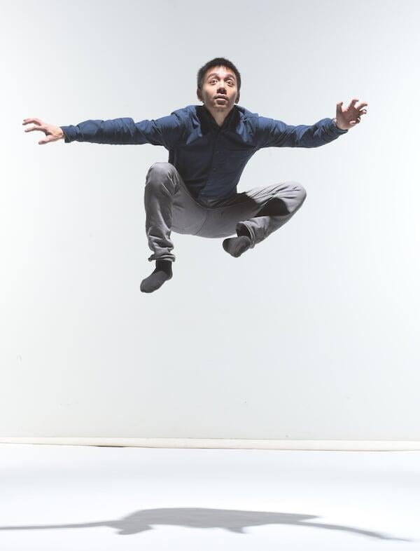 A photo of Chengyan Boon jumping; “testing” the camera before a Ballet BC photoshoot. Photo by Michael Slobodian.